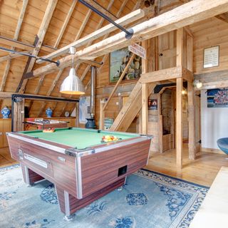watermill games room with 8 ball pool and wooden beams