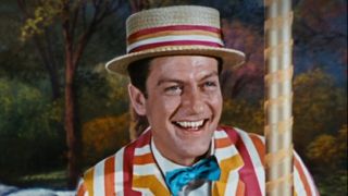 Dick Van Dyke in a colorful suit and hat in Marry Poppins.