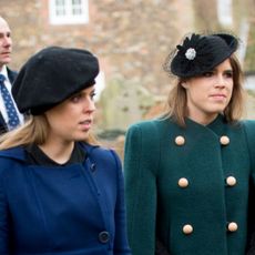 Princess Beatrice wears a blue coat and Princess Eugenie wears a green coat with gold buttons