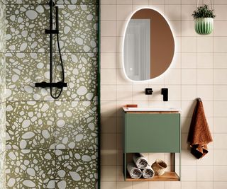 Green wall hung cabinet next to tiled shower