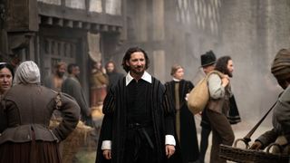 William Shakespeare (Daniel Boyarsky) walks through the streets of London in Shakespeare: Rise of a Genius