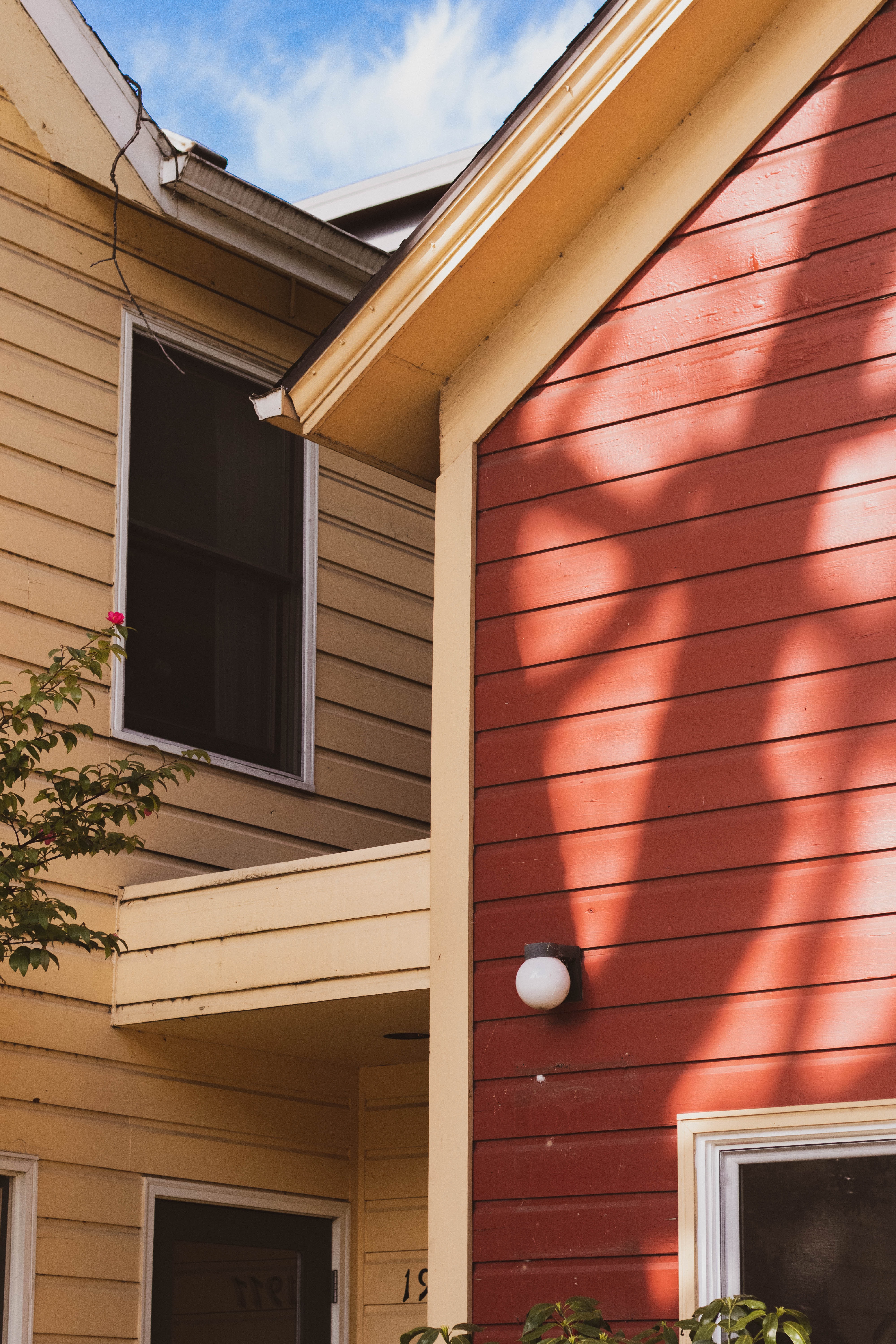 clean vinyl siding: brick red and yellow ochre