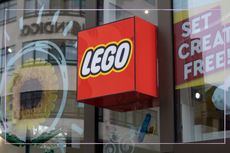 A Lego sign outside a shop