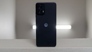 The Moto G Power 5G 2024 with a light behind it