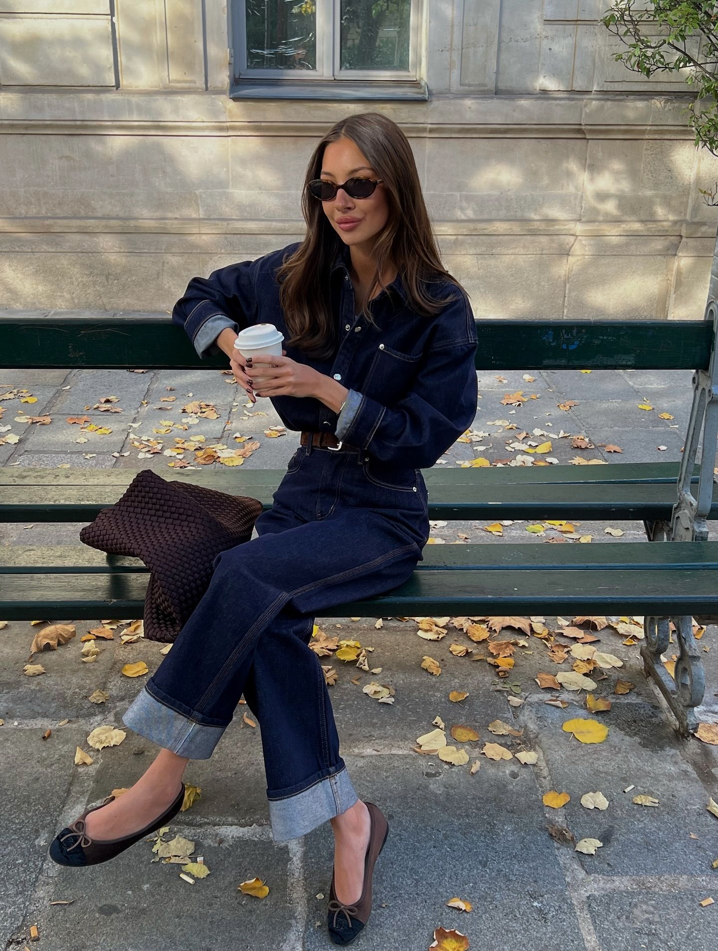 Woman wearing dark-wash jeans.