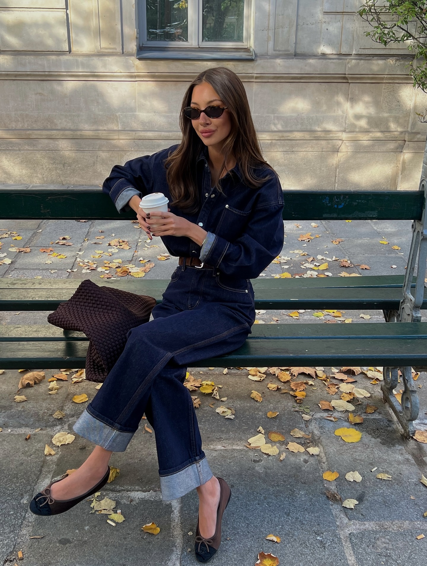Woman wearing dark-wash jeans.
