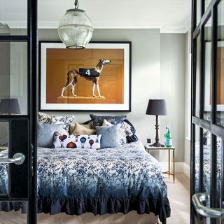 bedroom with wall frame and bedside table