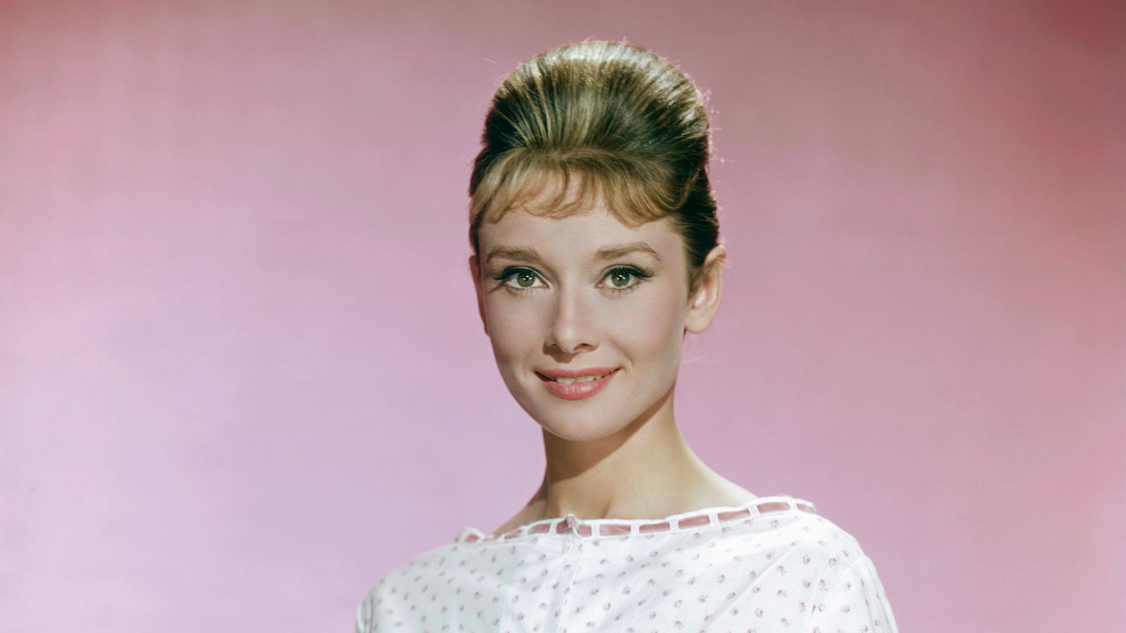 audrey hepburn on a pink background
