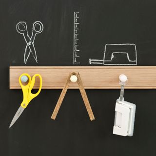 Chalkboard holding tools including scissors and ruler