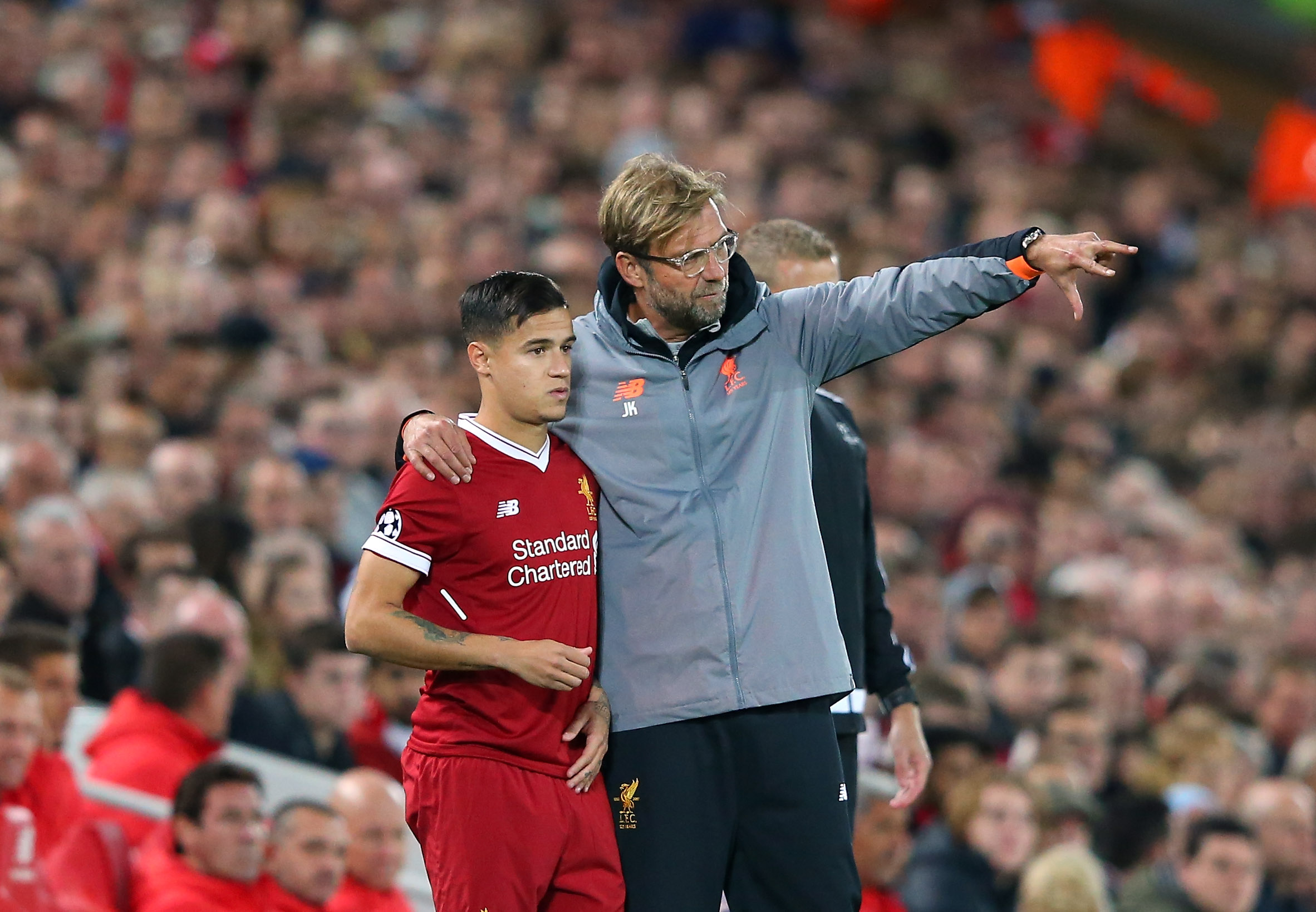 Liverpool manager Jurgen Klopp gives instructions to Philippe Coutinho in a match against Sevilla in September 2017.