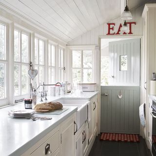 kitchen with white cabinet and posh graffiti