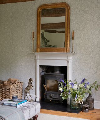 fireplace with woodburning stove in a Victorian cottage