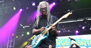 Blackbyrd McKnight taps out a solo on his blue Fender Stratocaster at a 2018 outdoor festival in Atlanta