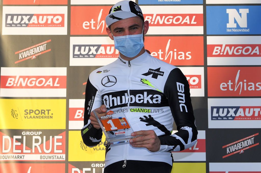 DOUR BELGIUM MARCH 02 Podium Victor Campenaerts of Belgium and Team Qhubeka Assos Most Combative Rider Celebration during the 53rd Grand Prix Le Samyn 2021 Mens Elite a 2054km race from Quaregnon to Dour Mask Covid Safety Measures GPSamyn on March 02 2021 in Dour Belgium Photo by Luc ClaessenGetty Images
