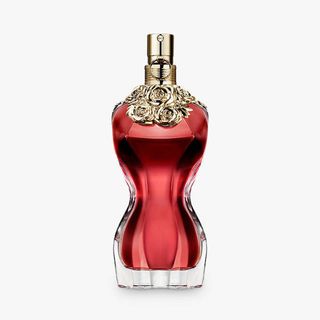 An image of a figure-shaped perfume bottle with a red fragrance from Jean Paul Gaultier inside in w&h's best vanilla perfume guide.
