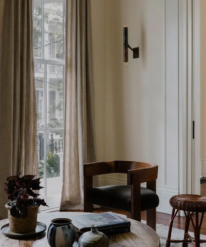 neutral living room with curved armchair