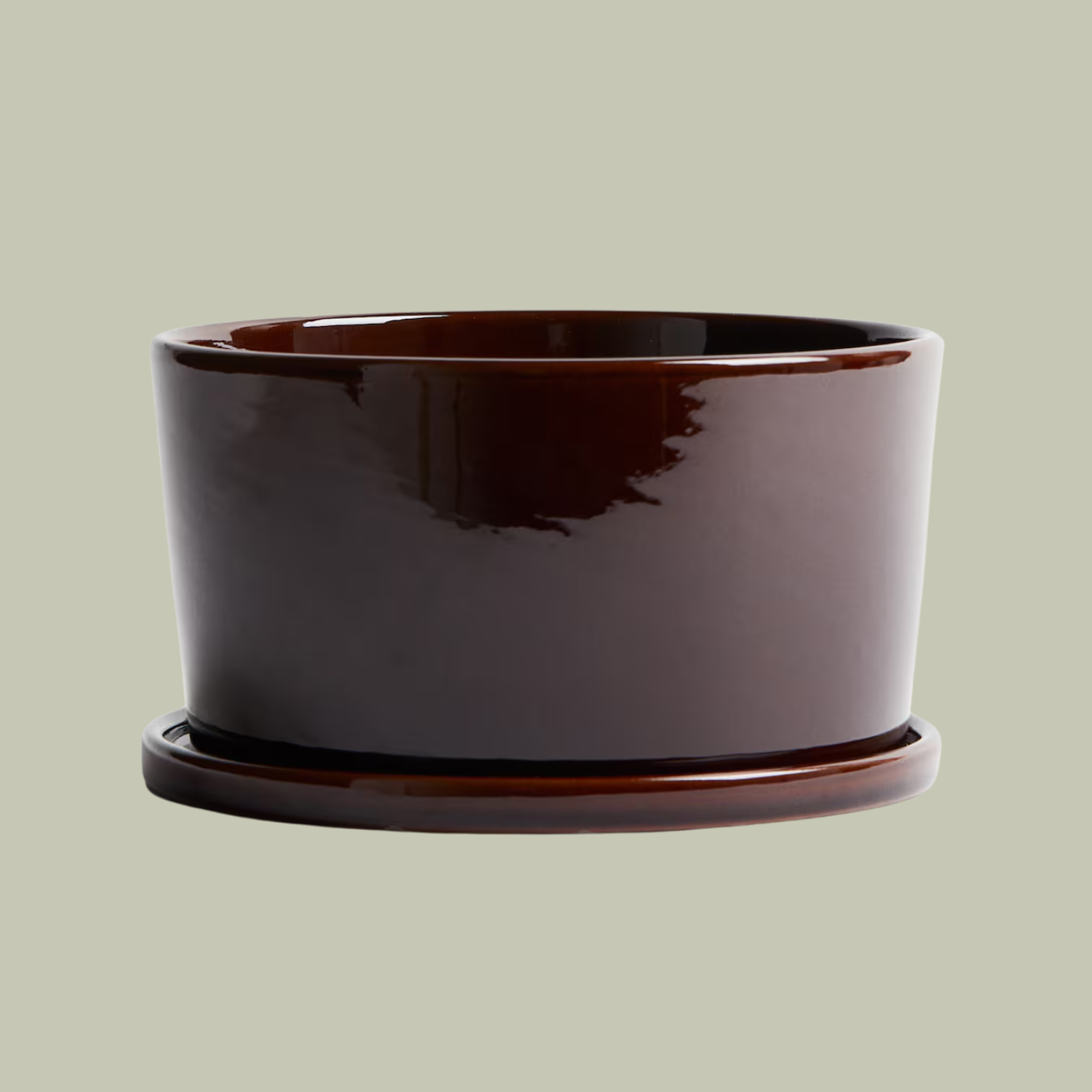 A wide dark brown terracotta planter and saucer