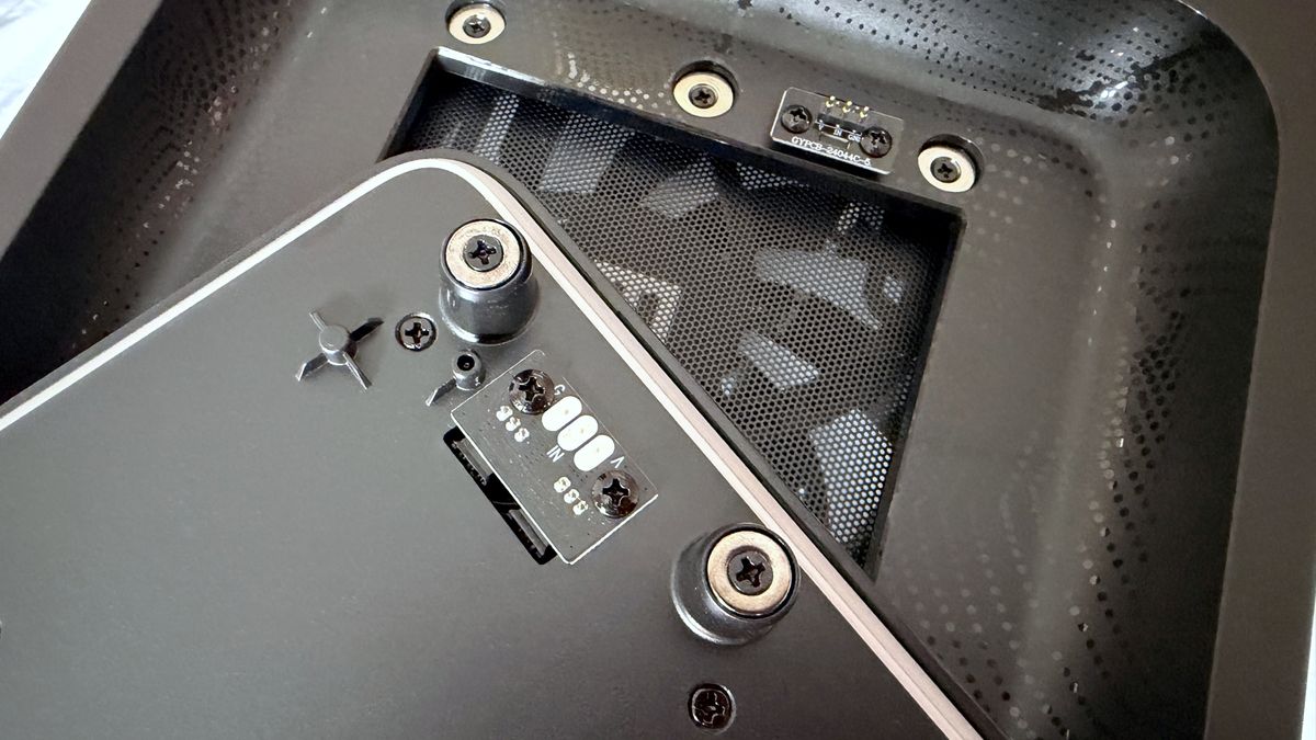 A close-up photo of the front panel magnetic catches as used in a Maingear MG-1 Mk.II gaming PC