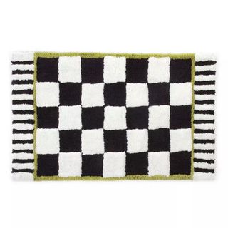 A checked bath mat in black and white
