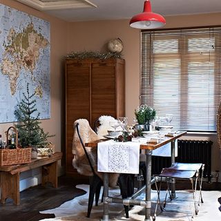 nordic style dining room with faux fur throws and map poster