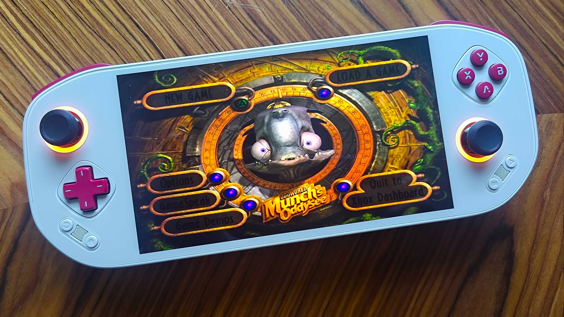 Mangmi Pocket Max with Oddworld: Munch's Odyssey main menu on screen.