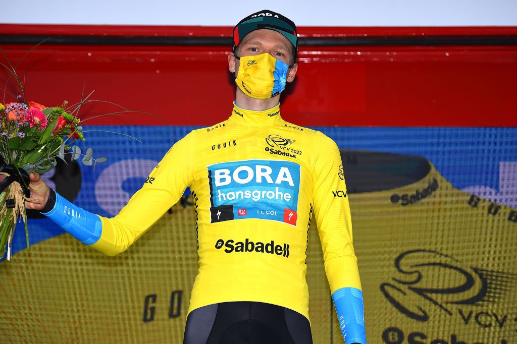 TORREVIEJA SPAIN FEBRUARY 05 Aleksander Vlasov of Russia and Team Bora Hansgrohe celebrates winning the yellow leader jersey on the podium ceremony after the 73rd Volta A La Comunitat Valenciana 2022 Stage 4 a 1931km stage from Orihuela to Torrevieja VCV2022 on February 05 2022 in Torrevieja Spain Photo by Dario BelingheriGetty Images