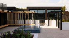 A small pool on a terrace of an apartment building