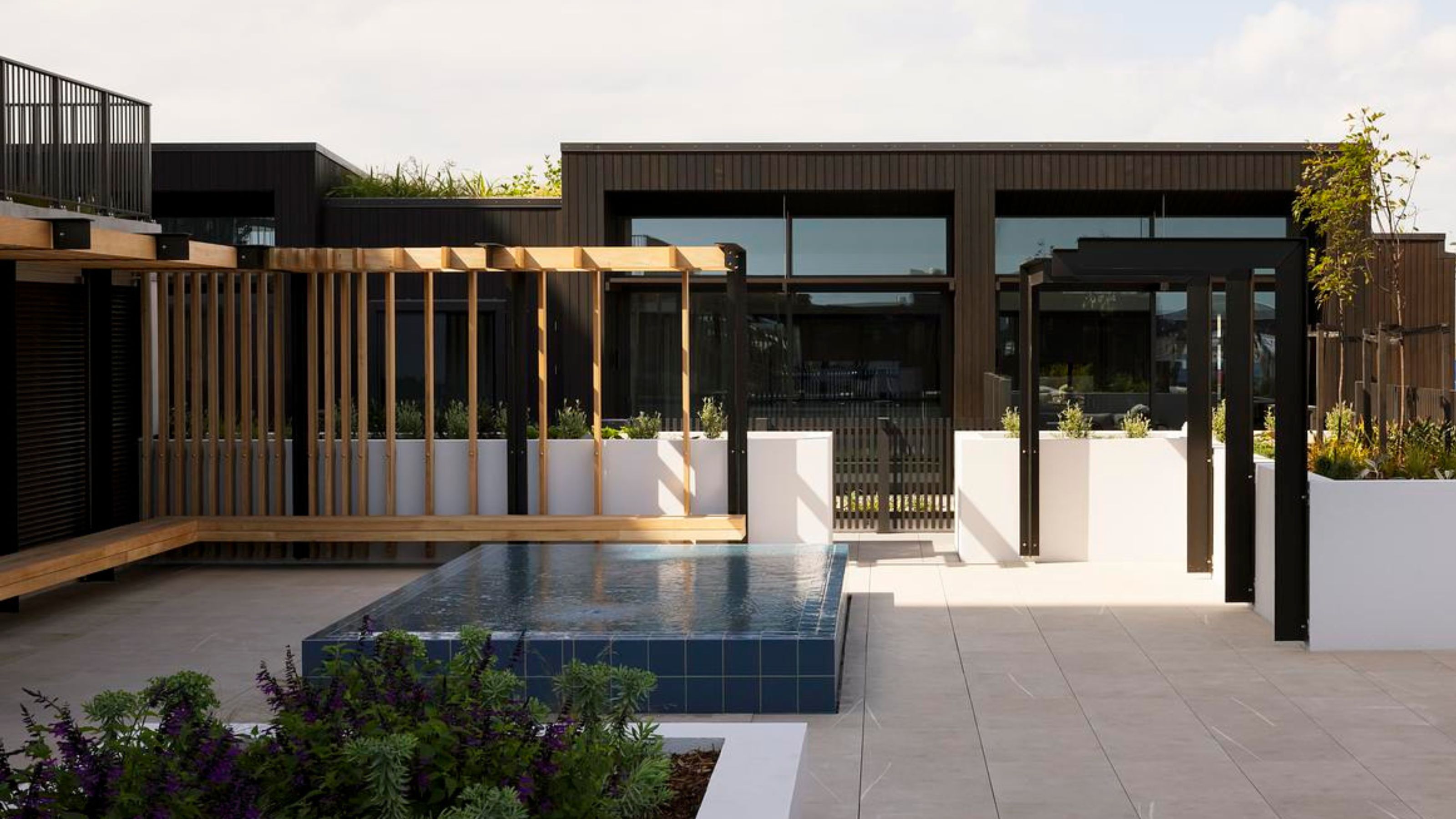 A small pool on a terrace of an apartment building 