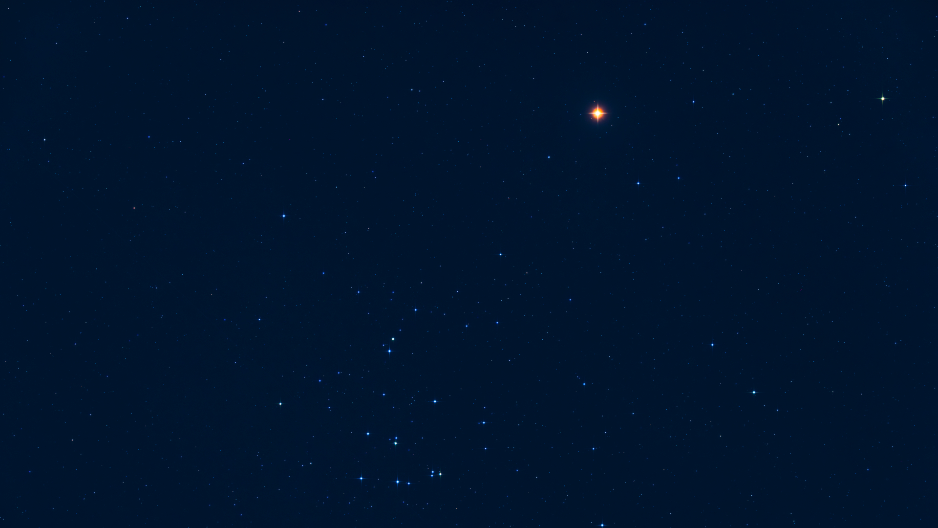 An image of the night sky showing Mars as a red star-light object close ot a number of blue-white stars against a dark blue sky.