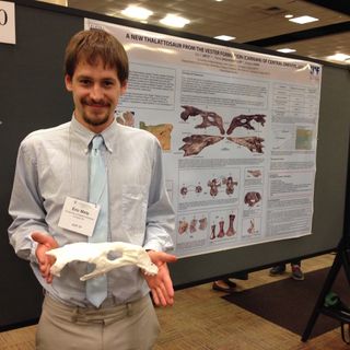 Eric Metz, a graduate student at the University of Alaska Fairbanks, holds a model of the newfound thalattosaur's skull.