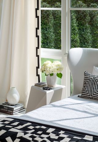 White and black bedding, cream curtains