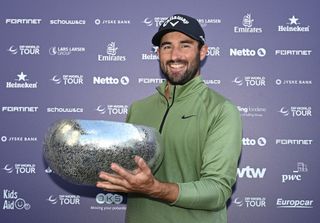 Frederic Lacroix holds the Danish Golf Championship trophy