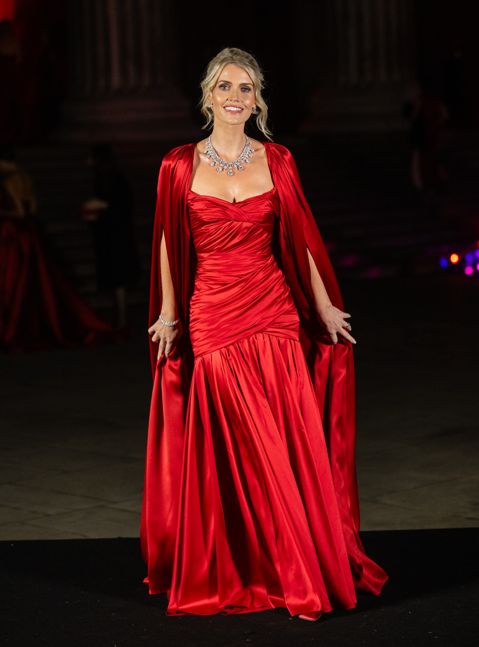Lady Kitty Spencer wearing a red gown and diamond necklace