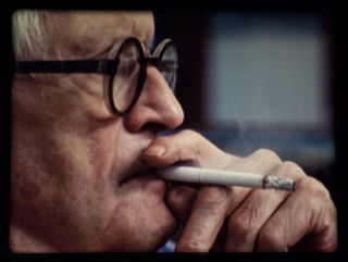potrait of David Hockney smoking, from a film by Tacita Dean