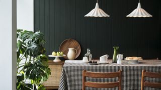 Scalloped pendant lights above a breakfast table