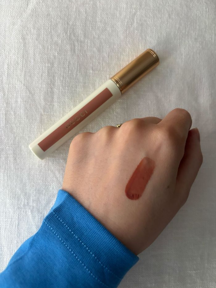 Deputy beauty editor Grace Lindsay swatching the Gucci Glow Oil-In-Water Tint Liquid Lipstick