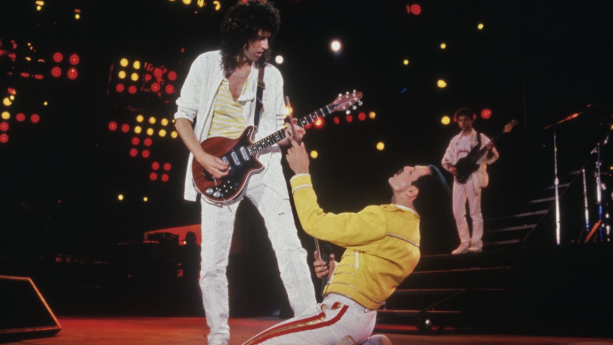 Singer Freddie Mercury (1946 - 1991) and guitarist Brian May of British rock band Queen in concert at Wembley Stadium, July 1986