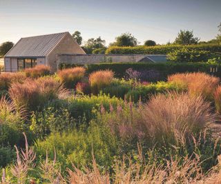 country farmhouse with large garden with wild planting