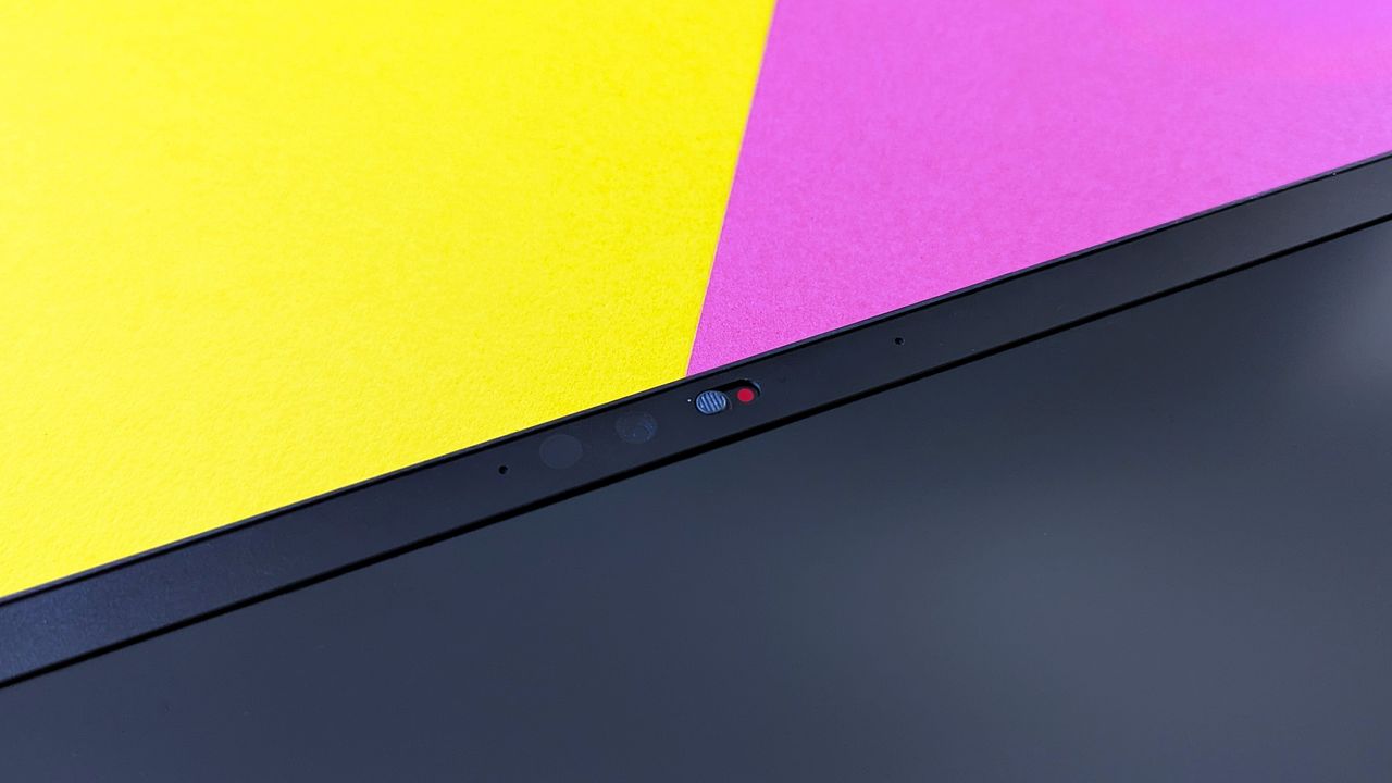Razer Blade 18 (2025) gaming laptop on a pink and yellow background.