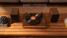 Crosley C65 in warm lighting on top of a wooden sideboard or unit