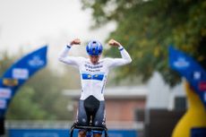 Belgian Thibau Nys celebrates as he crosses the finish line to win Rapencross