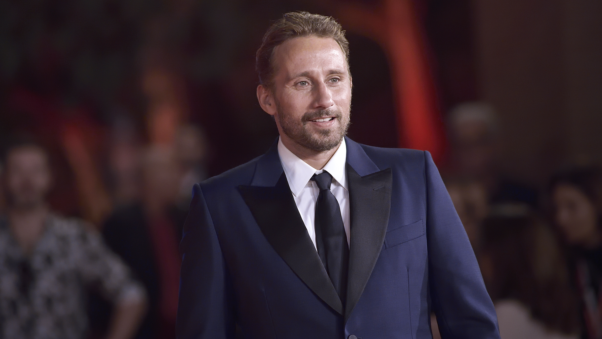 Matthias Schoenaerts posting for photographs at the 2022 Rome Film Festival