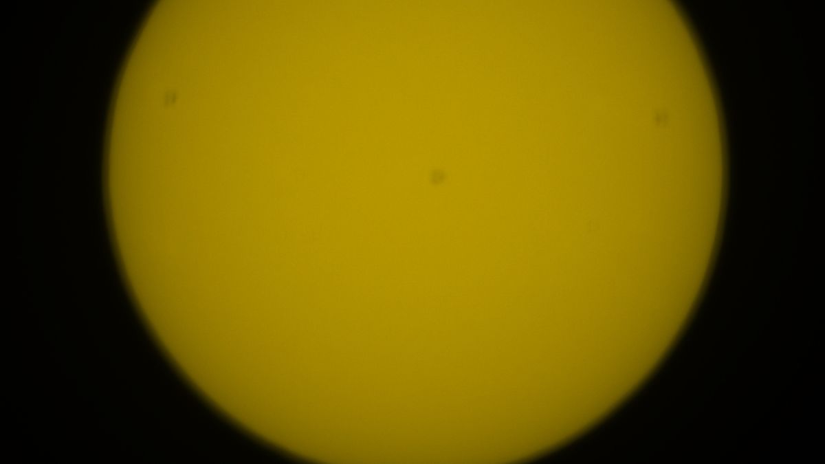 Part of the solar disk with unfocused sunspots.