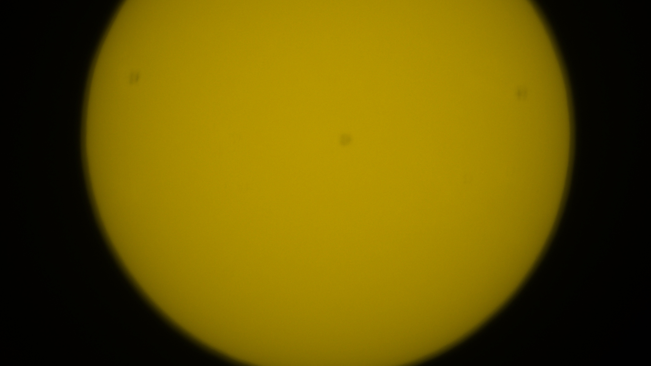 Part of the solar disk with unfocused sunspots.