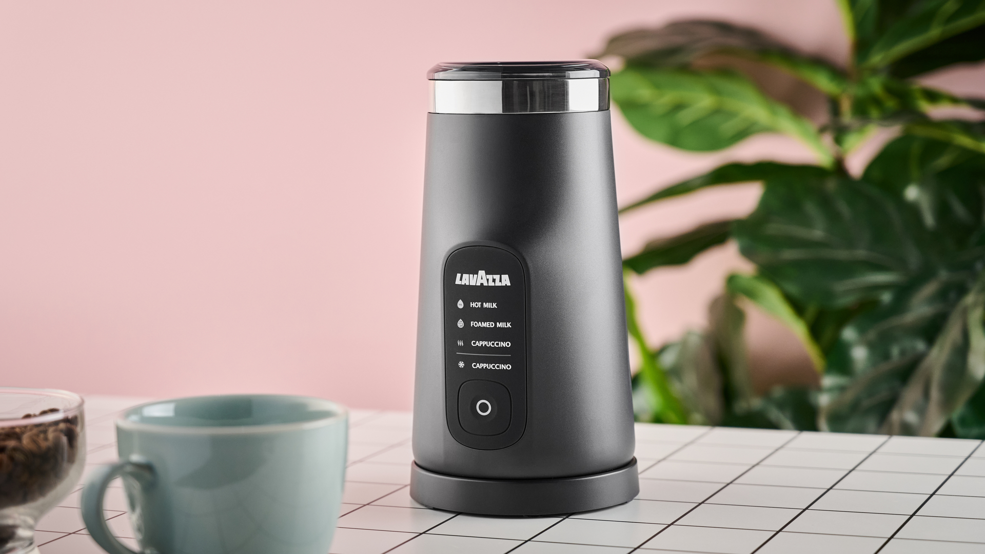 Lavazza MilkEasy Plus on table with mug and coffee beans