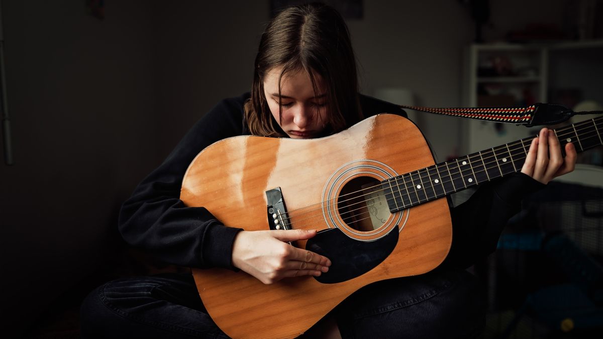 Young Man Playing Guitar