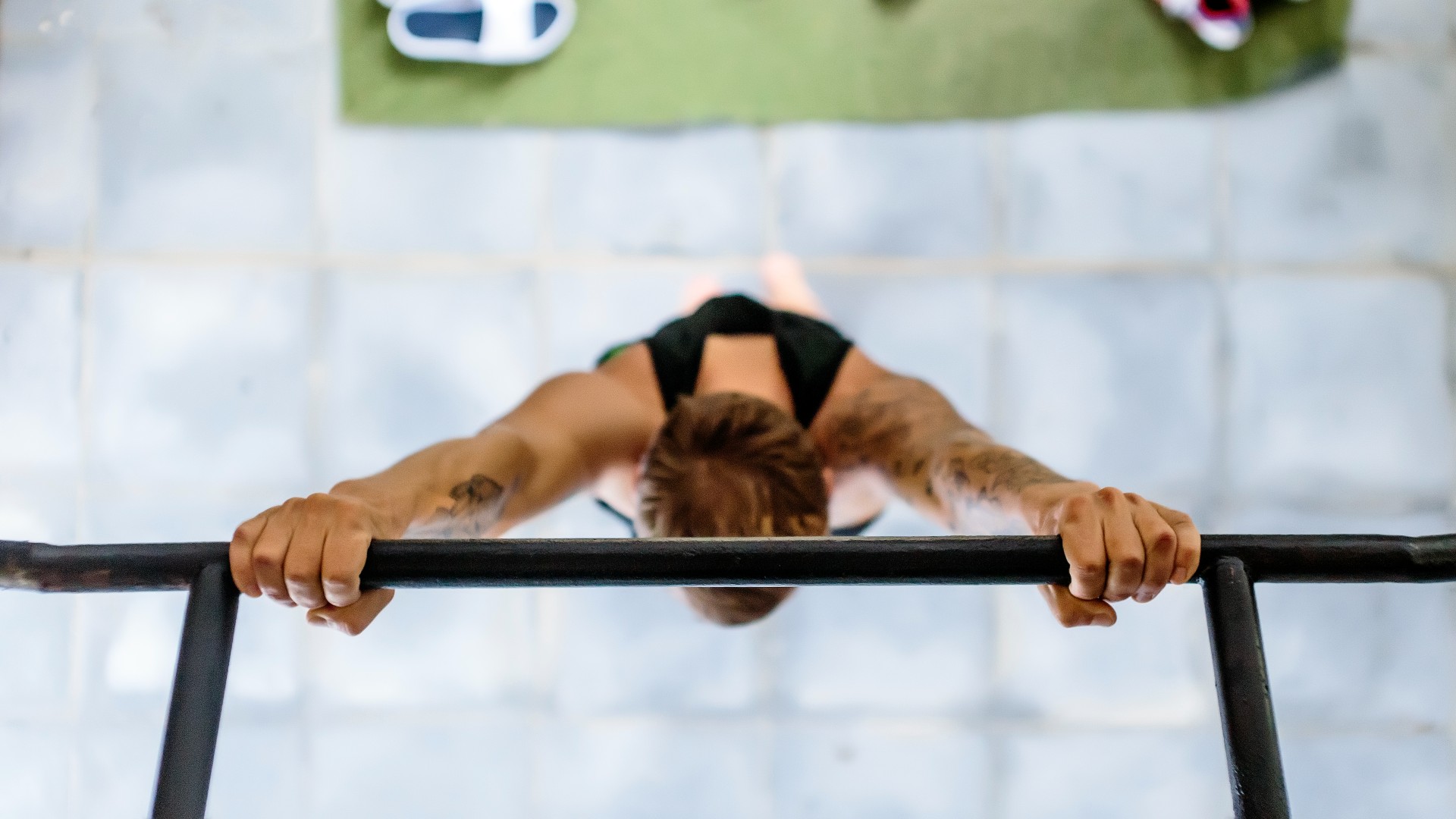 Man performing a pull-up using an overhand grip