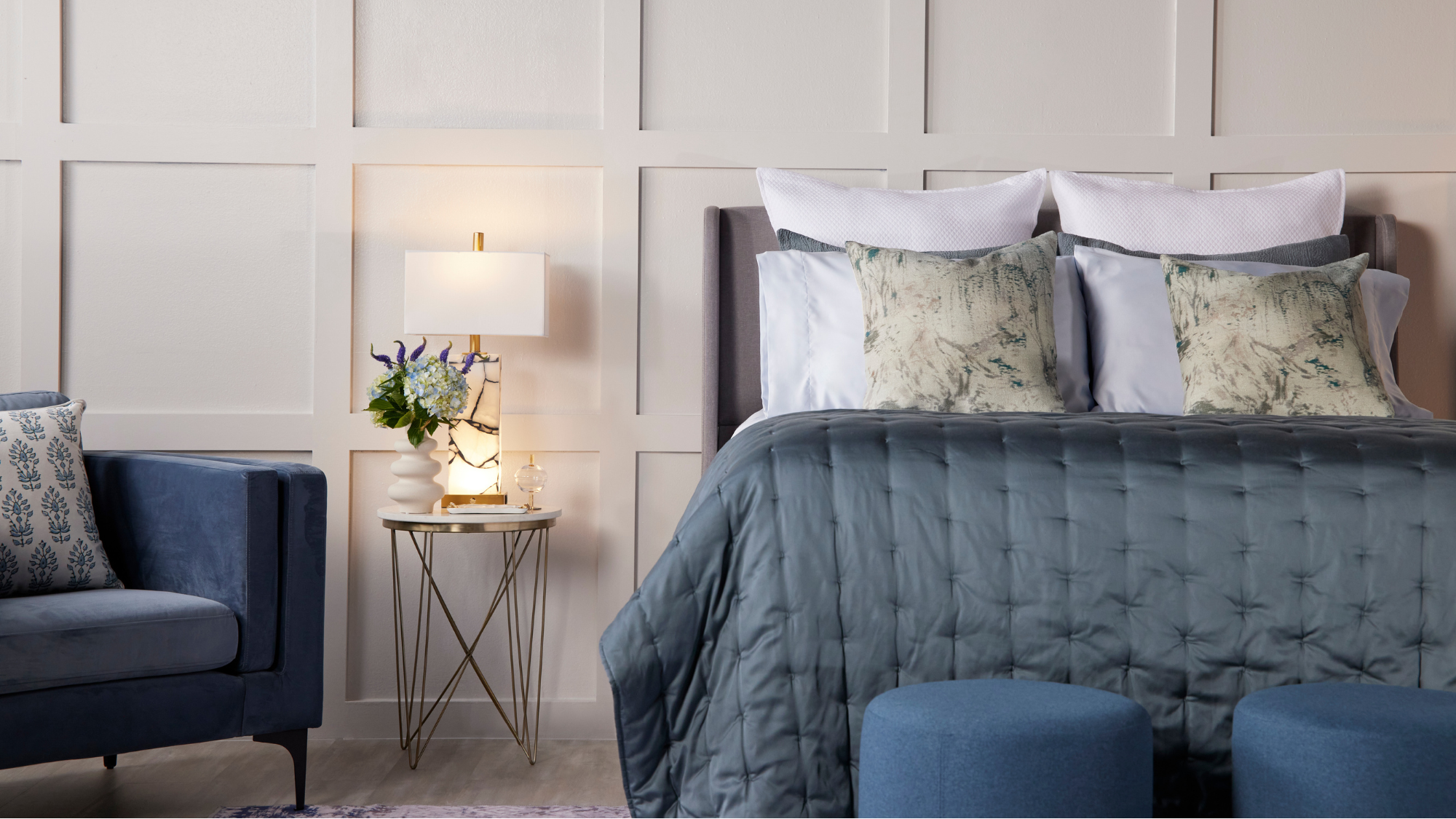 bed in white panelled room