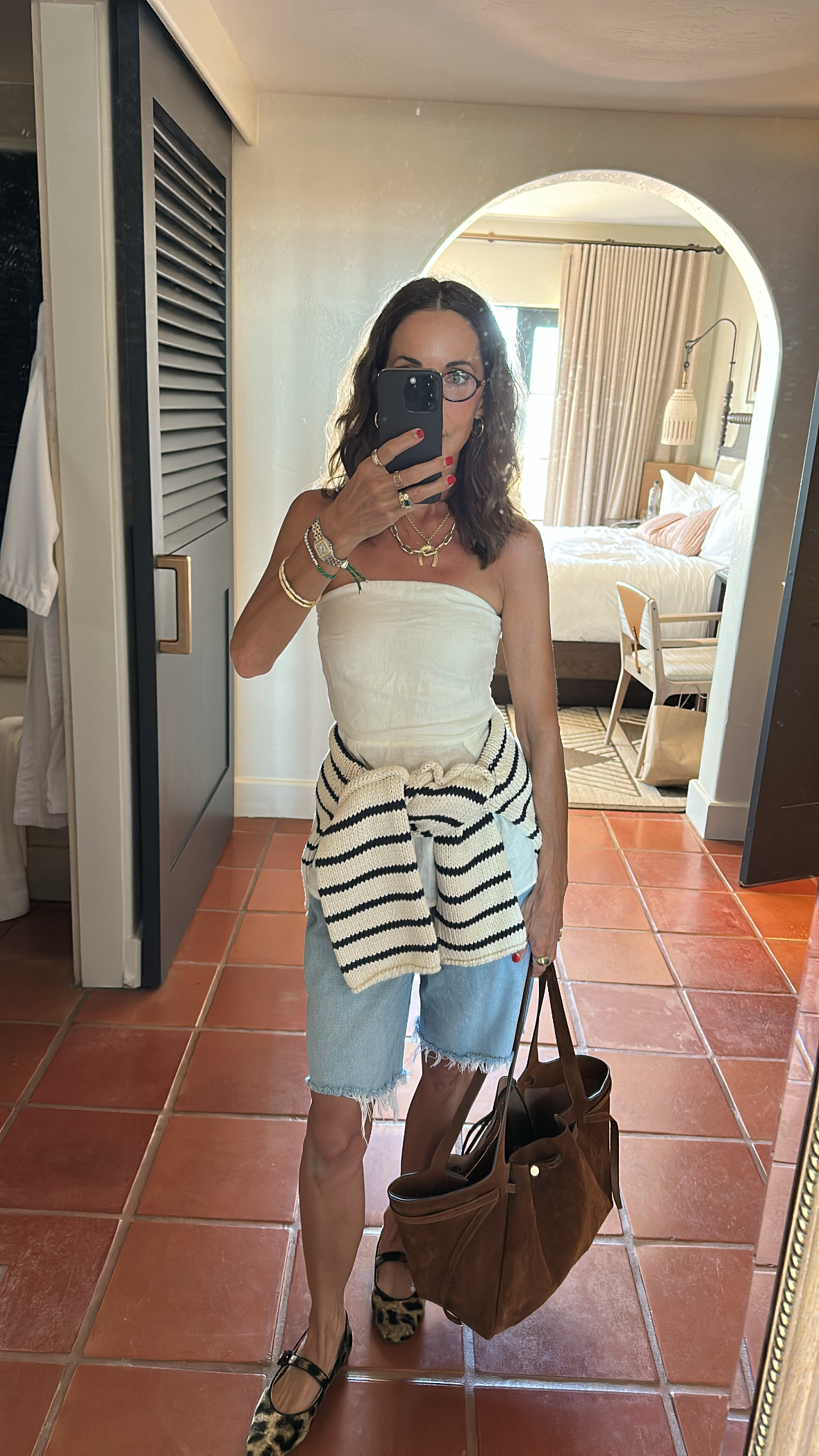 Larissa Mills wearing a sweater tied around her waist