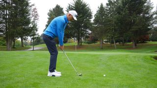 PGA pro Barney Puttick demonstrating a common fault among golfers when chipping - standing too far from the ball